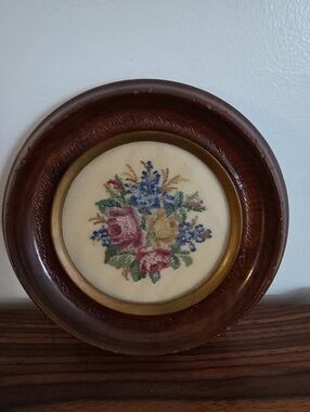 Vintage petit point needlework picture featuring a floral bouquet  Framed